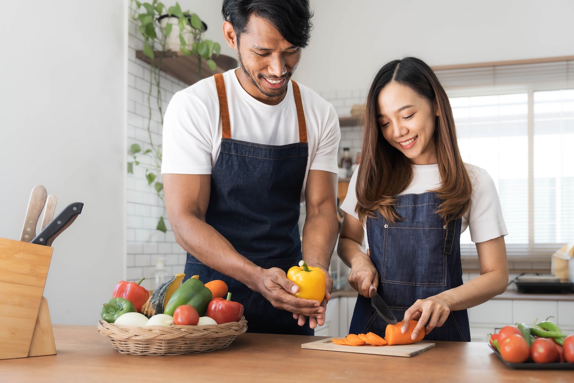 TTC man and woman cooking with fertility foods