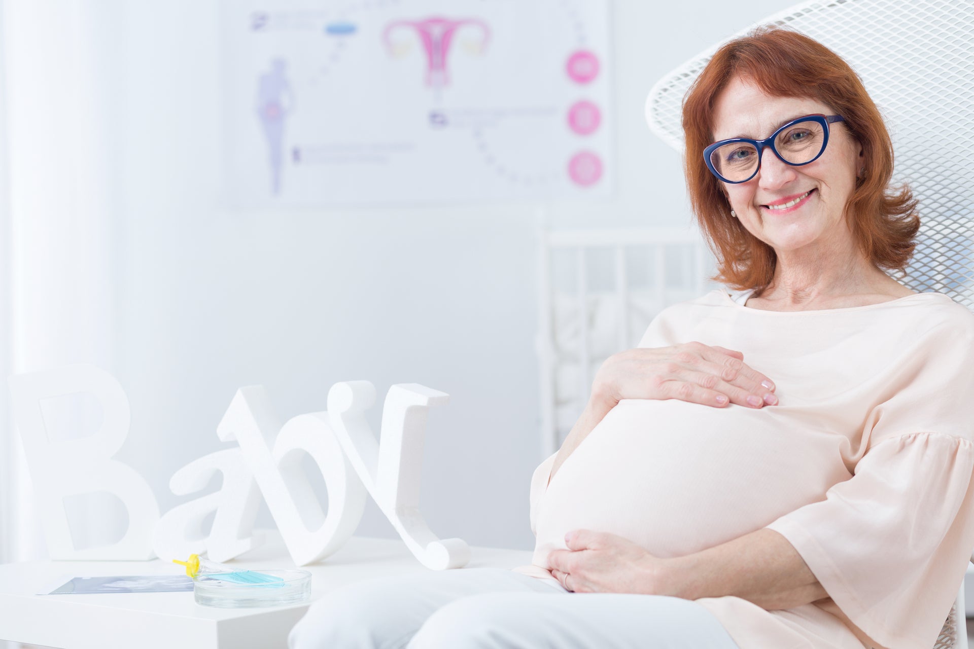 a pregnant menopausal woman smiling