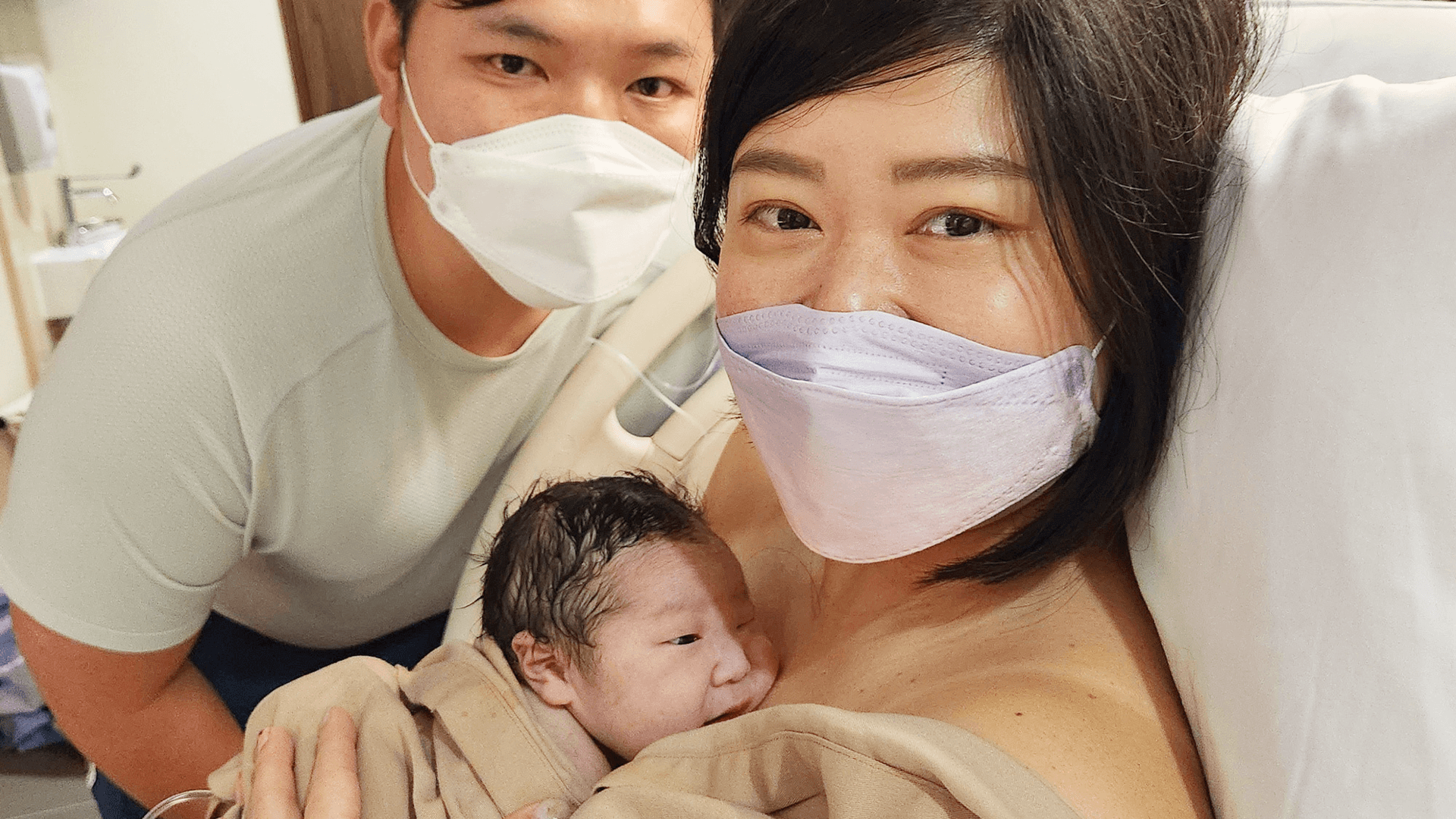 Celena and her husband with their newborn baby